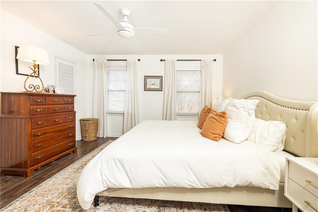 1101 Collier Road Northwest, Unit A4 Atlanta, GA 30318 - Photo 23 of 27 a bedroom with a bed and a dresser