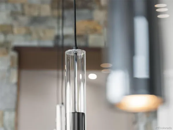 a close view of light fixtures and wooden floor