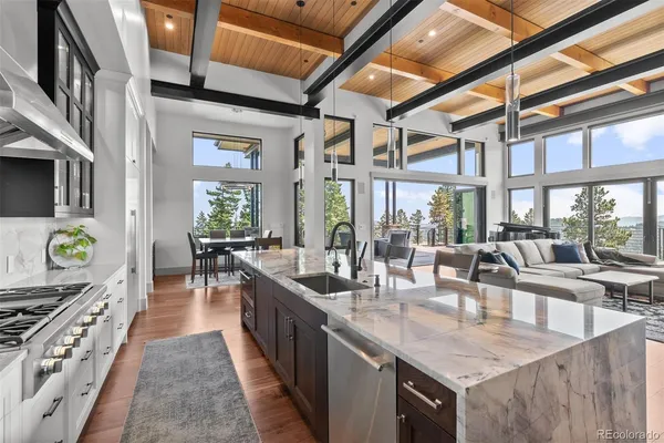 a kitchen with sink stove and cabinets