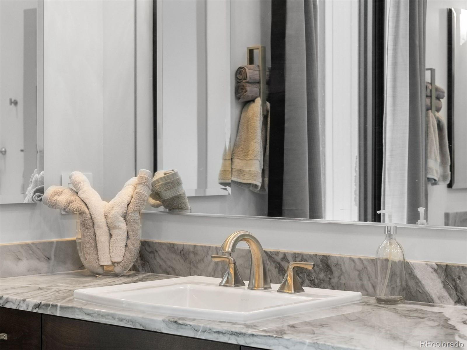 1082 West Meadow Road Evergreen, CO 80439 - Photo 26 of 50 a bathroom with sink and mirror