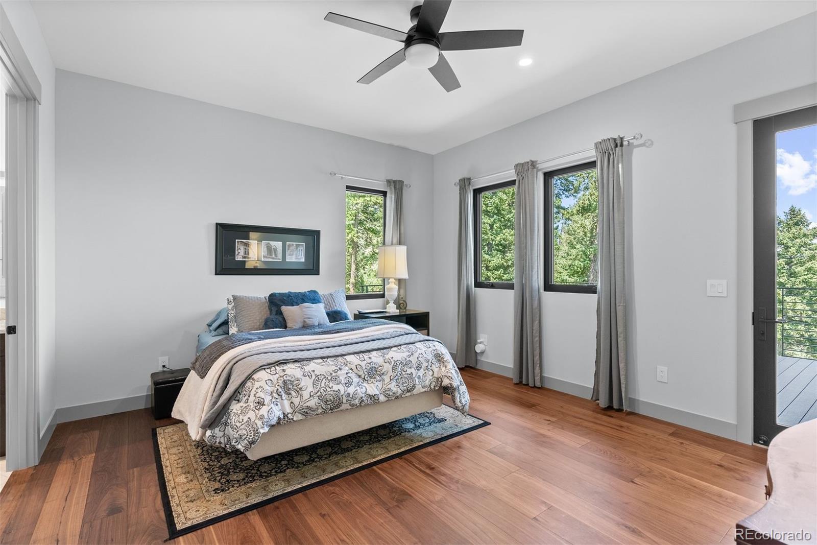 1082 West Meadow Road Evergreen, CO 80439 - Photo 34 of 50 a bedroom with a bed and window