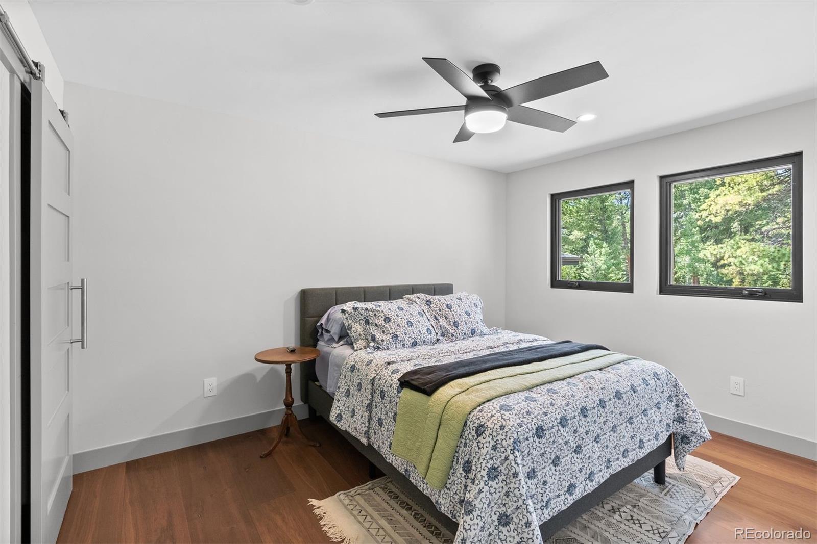 1082 West Meadow Road Evergreen, CO 80439 - Photo 41 of 50 a bedroom with a bed and window