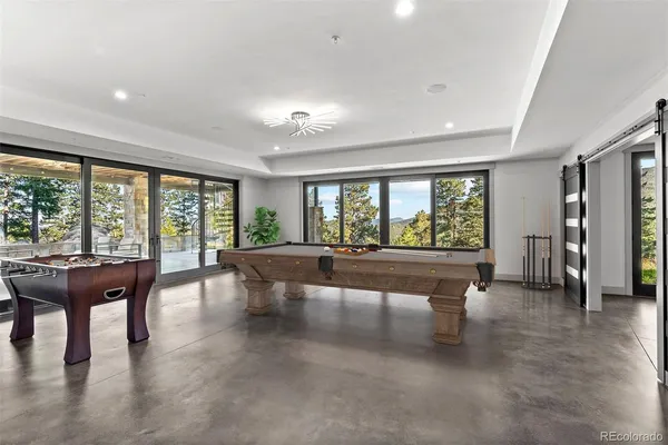 a dining table with chairs and cabinets