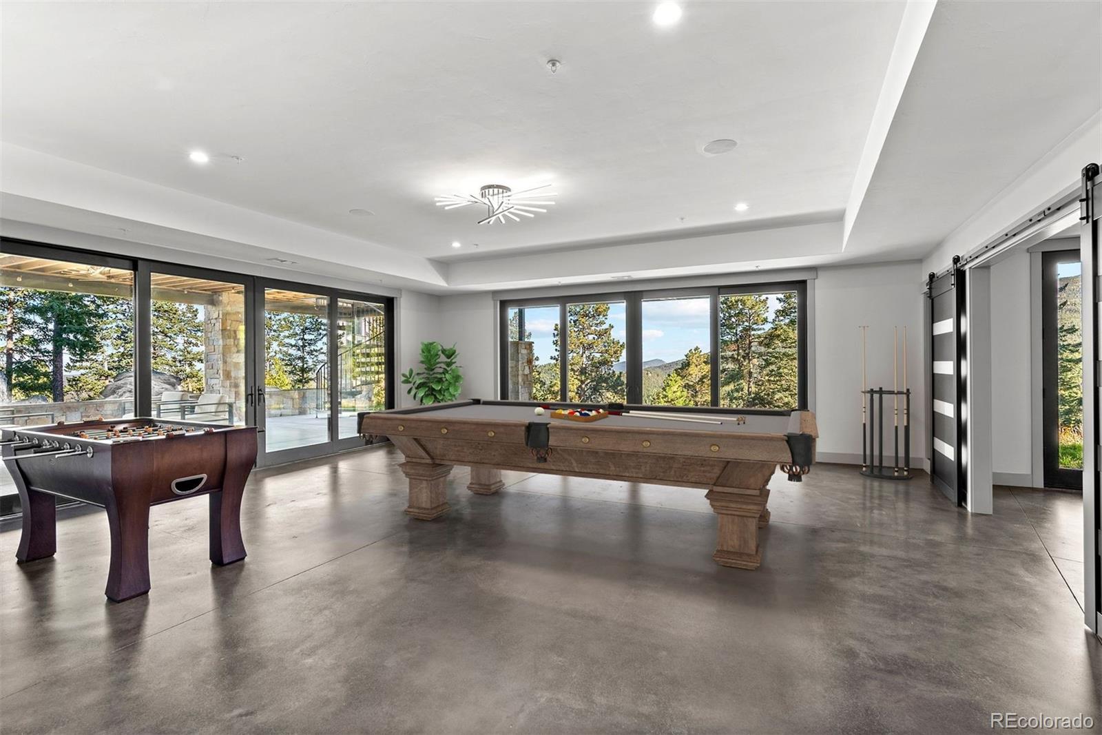 1082 West Meadow Road Evergreen, CO 80439 - Photo 43 of 50 a view of a large room with furniture water view and windows