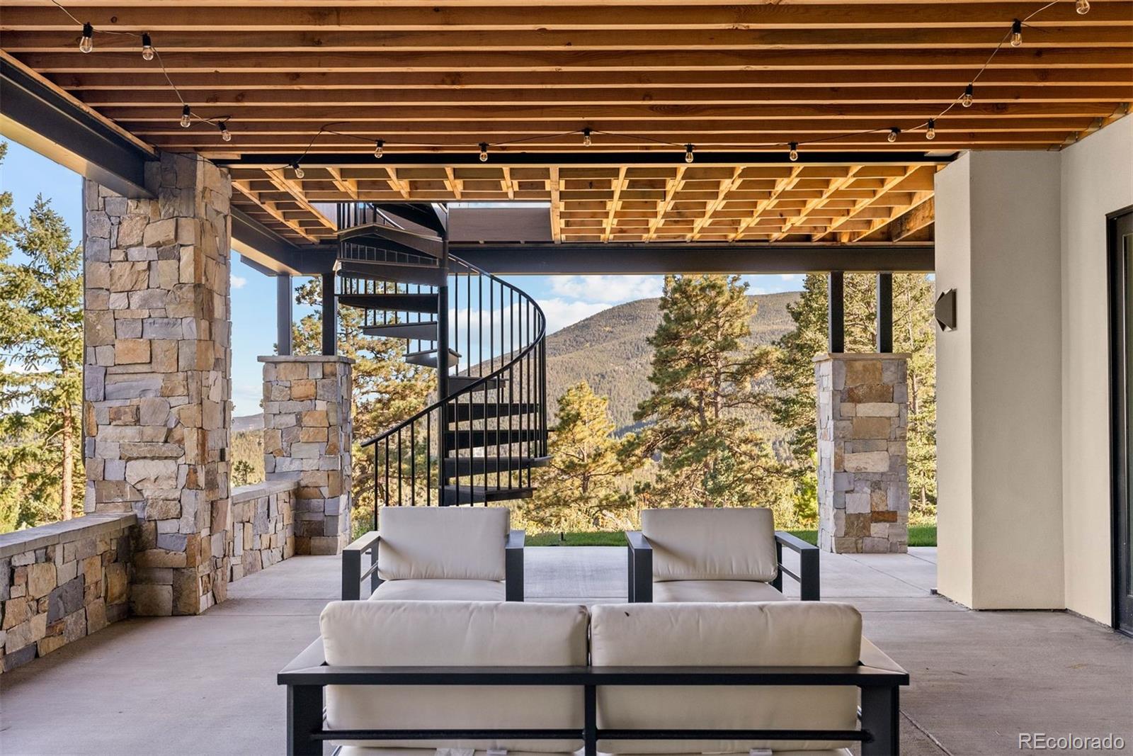 1082 West Meadow Road Evergreen, CO 80439 - Photo 44 of 50 a view of balcony with furniture