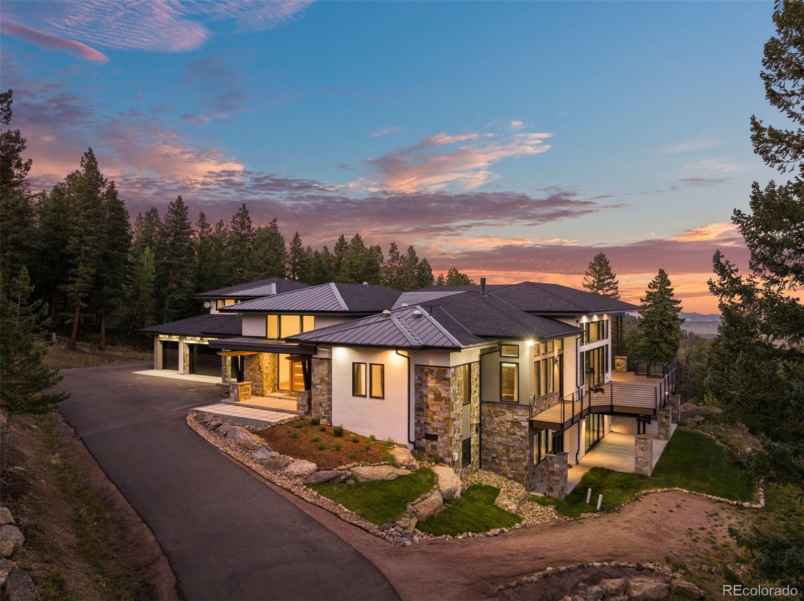 1082 West Meadow Road Evergreen, CO 80439 - Photo 49 of 50 a front view of a house with a yard