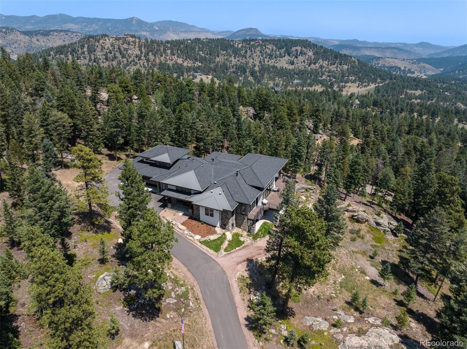 1082 West Meadow Road Evergreen, CO 80439 - Photo 50 of 50 an aerial view of a house with a yard