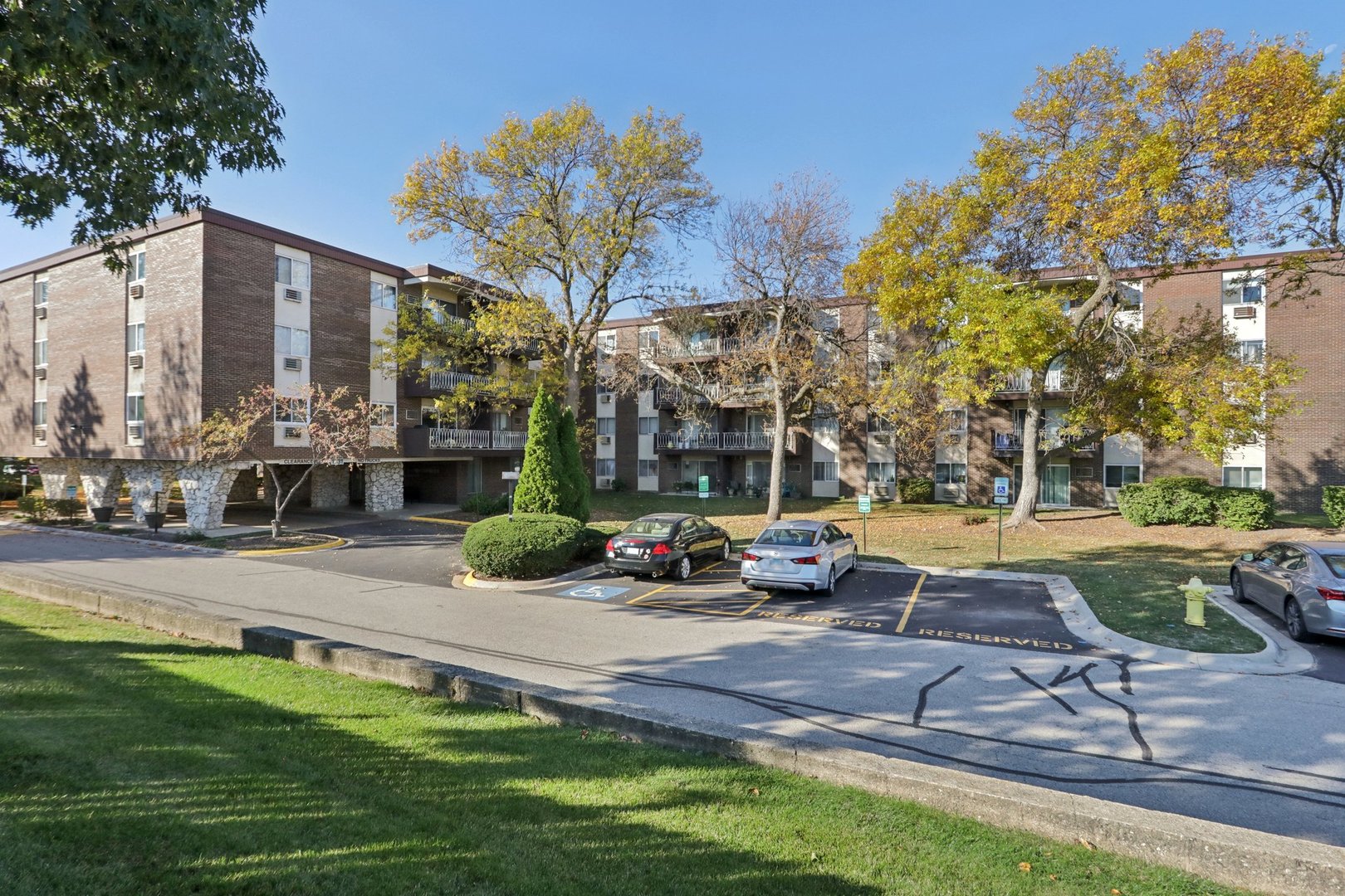 1331 South Finley Road, Unit 215 Lombard, IL 60148 - Photo 1 of 18 a view of a patio with couches and a fire pit
