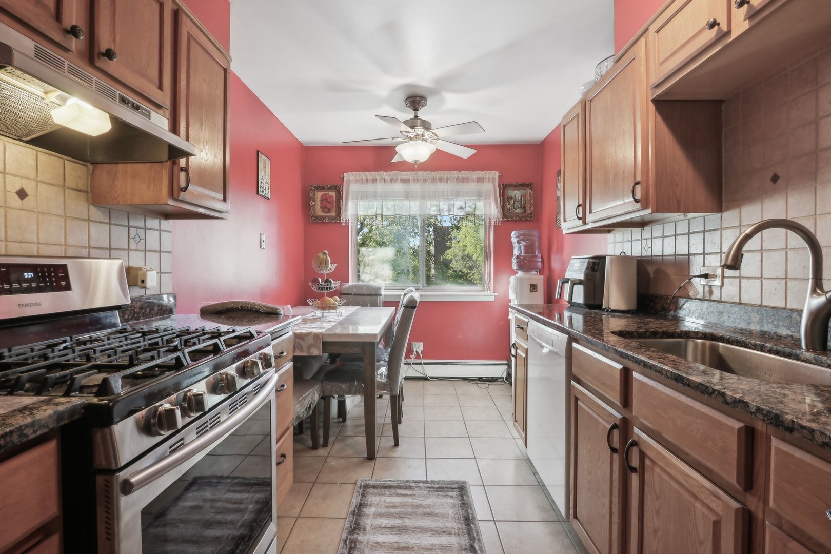 1331 South Finley Road, Unit 215 Lombard, IL 60148 - Photo 7 of 18 a kitchen with stainless steel appliances a sink stove and cabinets