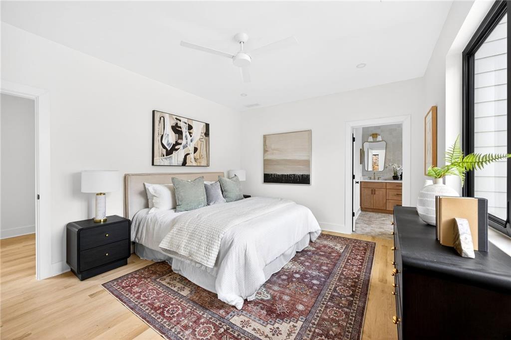 1348 Finley Street Northeast Atlanta, GA 30307 - Photo 16 of 47 a bedroom with a large bed and a couch