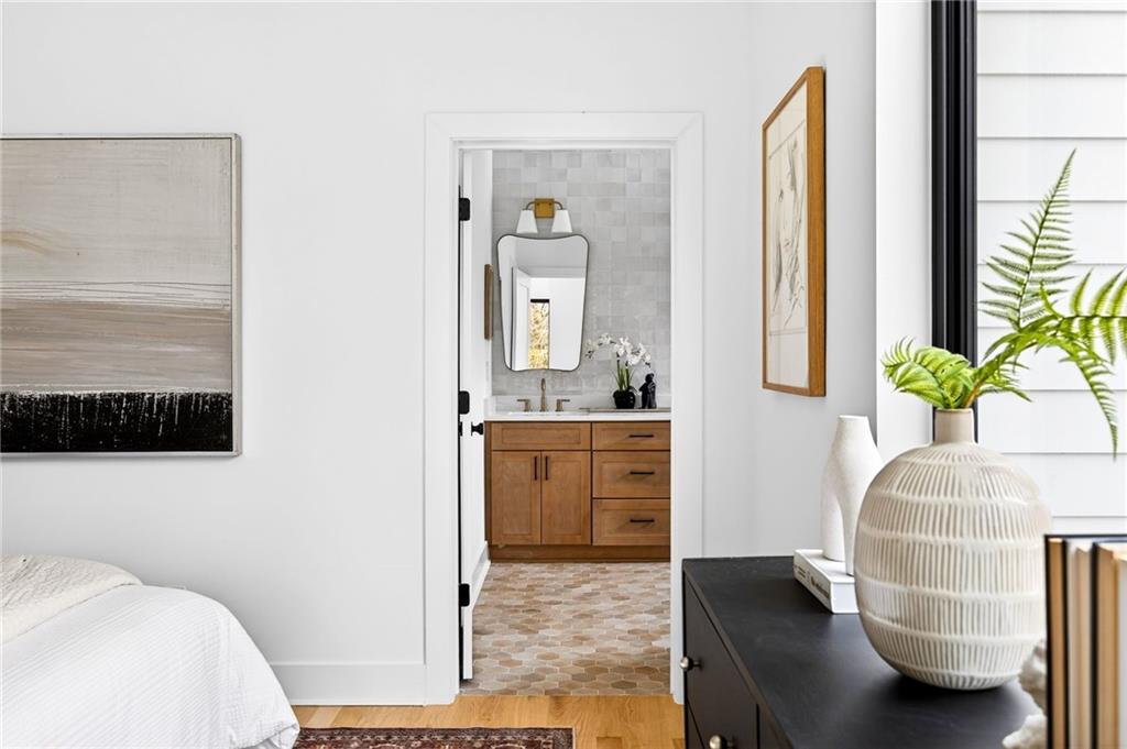 1348 Finley Street Northeast Atlanta, GA 30307 - Photo 17 of 47 a en suite bathroom with a granite countertop sink and a mirror