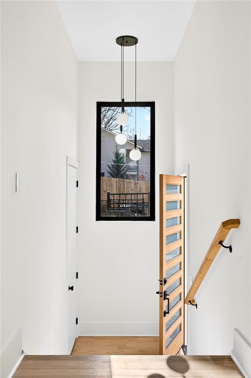 1348 Finley Street Northeast Atlanta, GA 30307 - Photo 2 of 47 a view of a hallway with wooden floor and a chandelier