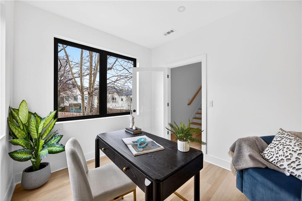 1348 Finley Street Northeast Atlanta, GA 30307 - Photo 31 of 47 a view of a workspace with furniture and a potted plant