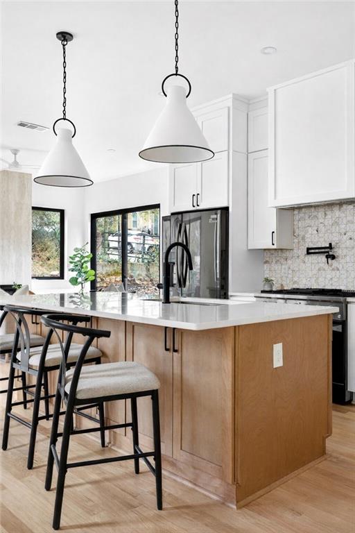 1348 Finley Street Northeast Atlanta, GA 30307 - Photo 4 of 47 a kitchen with stainless steel appliances granite countertop a stove a sink and a refrigerator