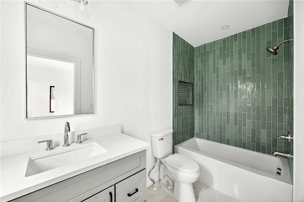 1348 Finley Street Northeast Atlanta, GA 30307 - Photo 41 of 47 a bathroom with a sink a toilet and shower