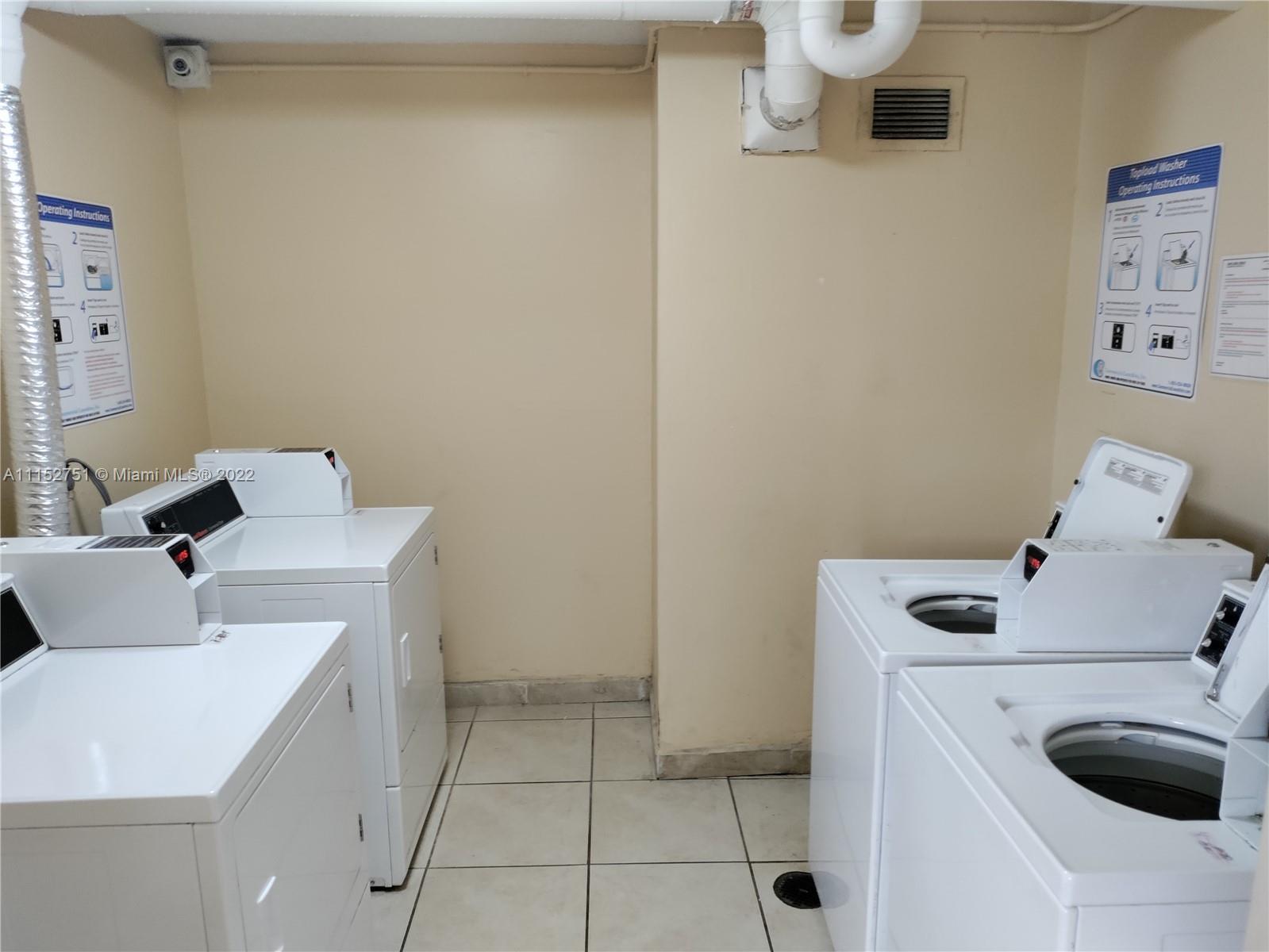 7000 Northwest 186th Street, Unit 4325 Hialeah, FL 33015 - Photo 7 of 10 a utility room with dryer and washer
