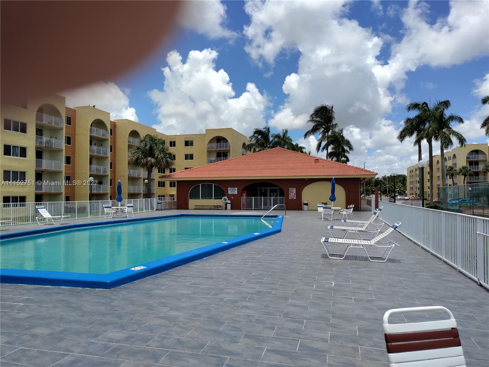 7000 Northwest 186th Street, Unit 4325 Hialeah, FL 33015 - Photo 10 of 10 a view of a house with swimming pool and porch