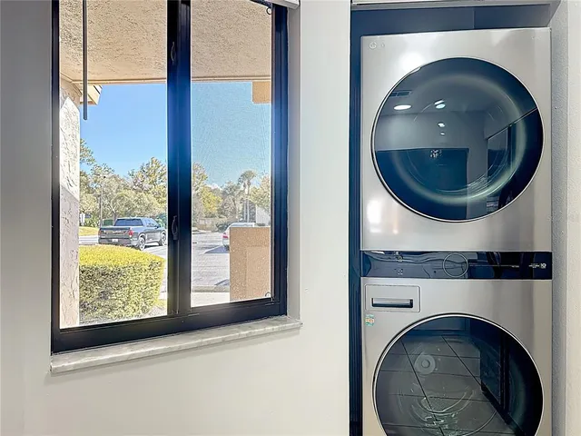 a view of a brick house with a large window