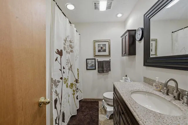 a view of staircase with white walls and railing