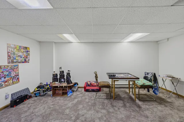 a room with furniture and white walls