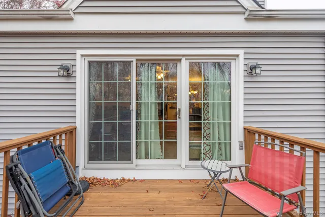 a view of a two chairs on the roof deck
