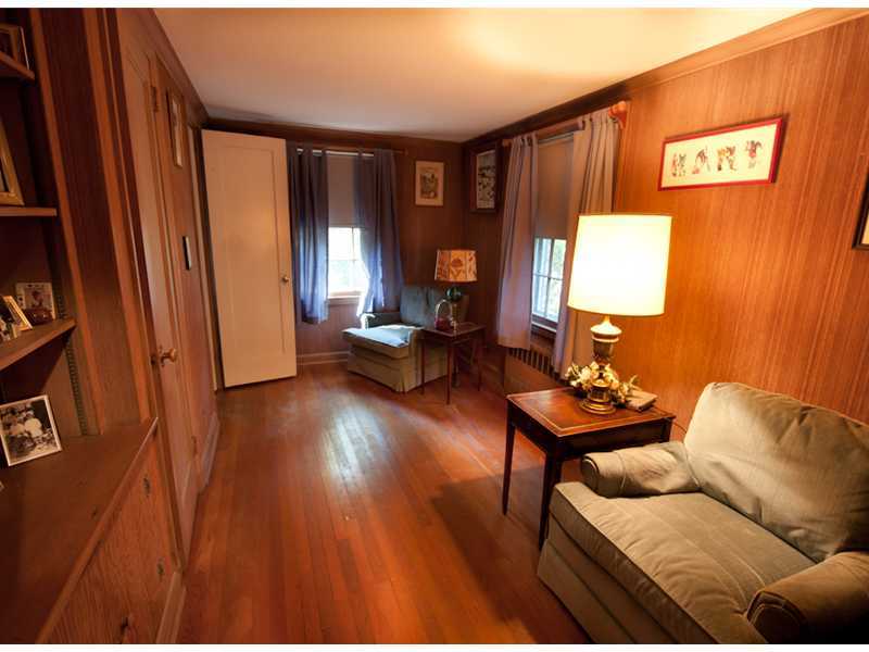 Undisclosed Address Riverside, CT 06878 - Photo 5 of 8 a living room with furniture and a lamp