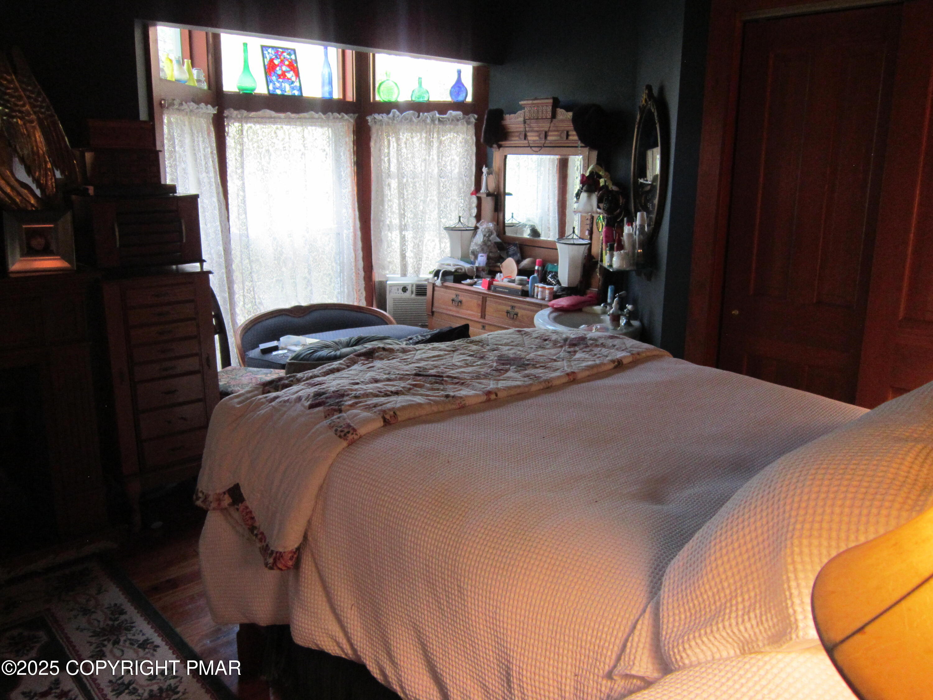 642 Tulip Tree Lane Cresco, PA 18326 - Photo 13 of 40 a bed sitting in a bedroom next to a window