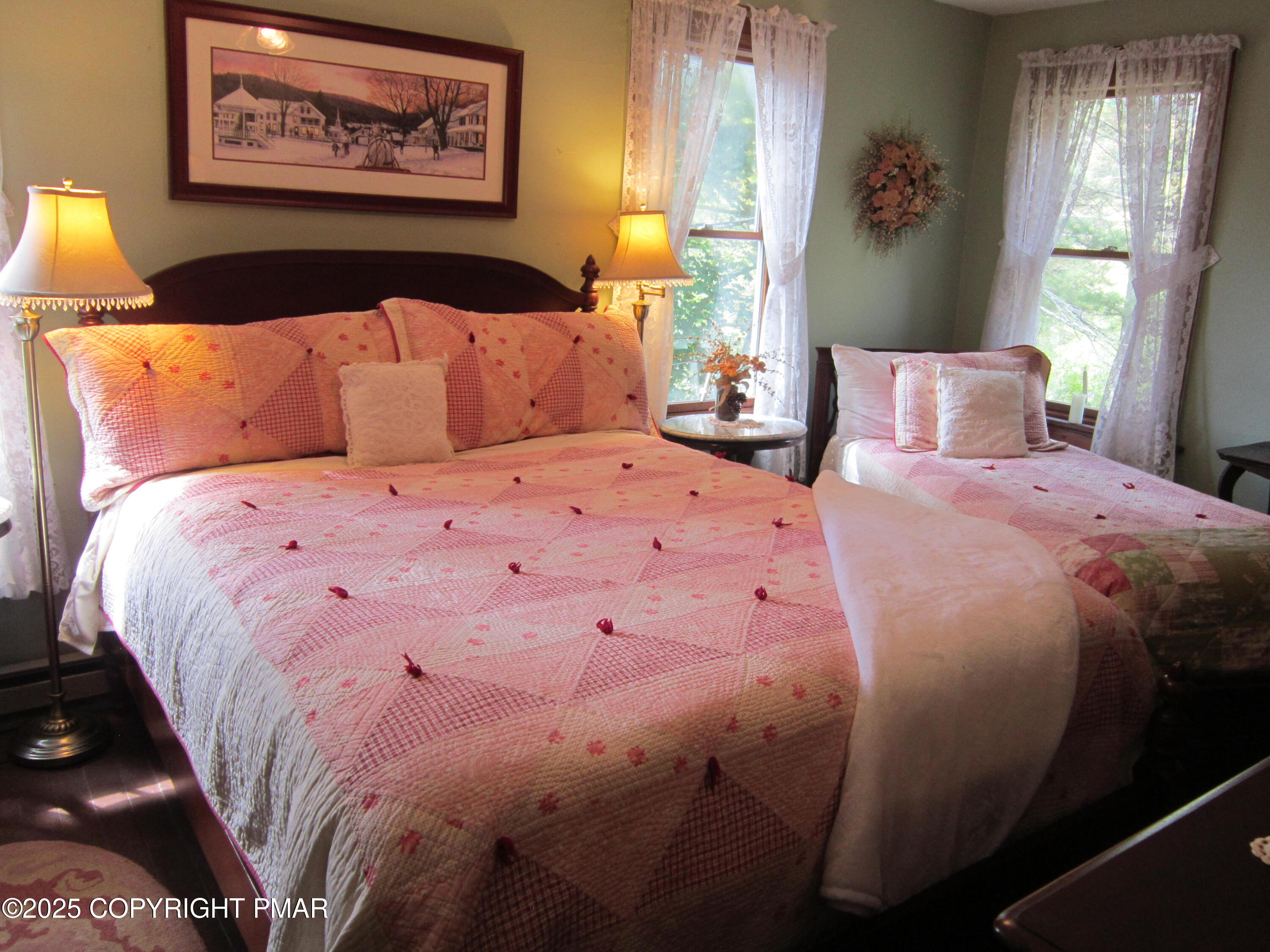 642 Tulip Tree Lane Cresco, PA 18326 - Photo 15 of 40 a large bed sitting in a bedroom next to a window