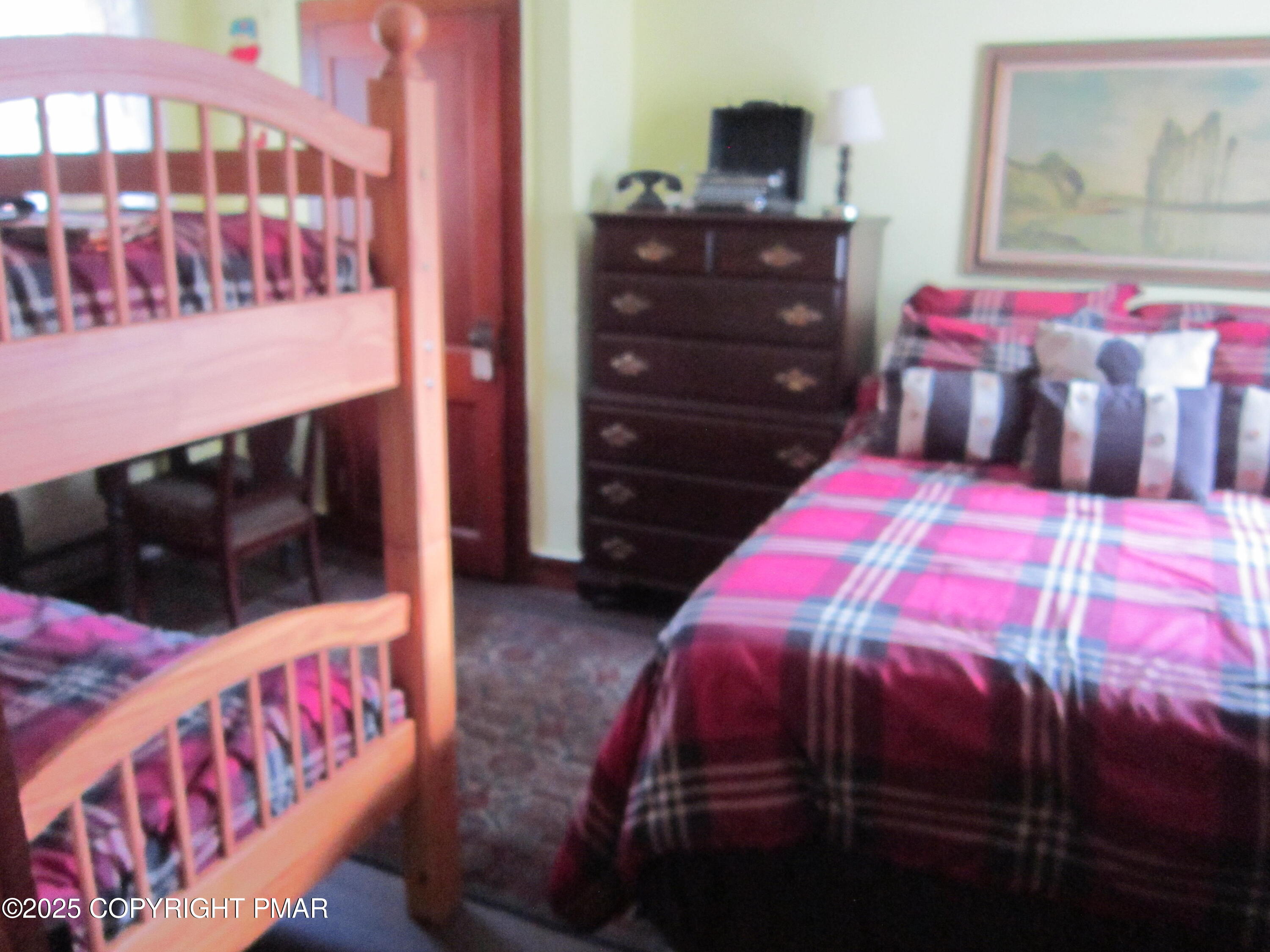 642 Tulip Tree Lane Cresco, PA 18326 - Photo 17 of 40 a bedroom with a bed and a television