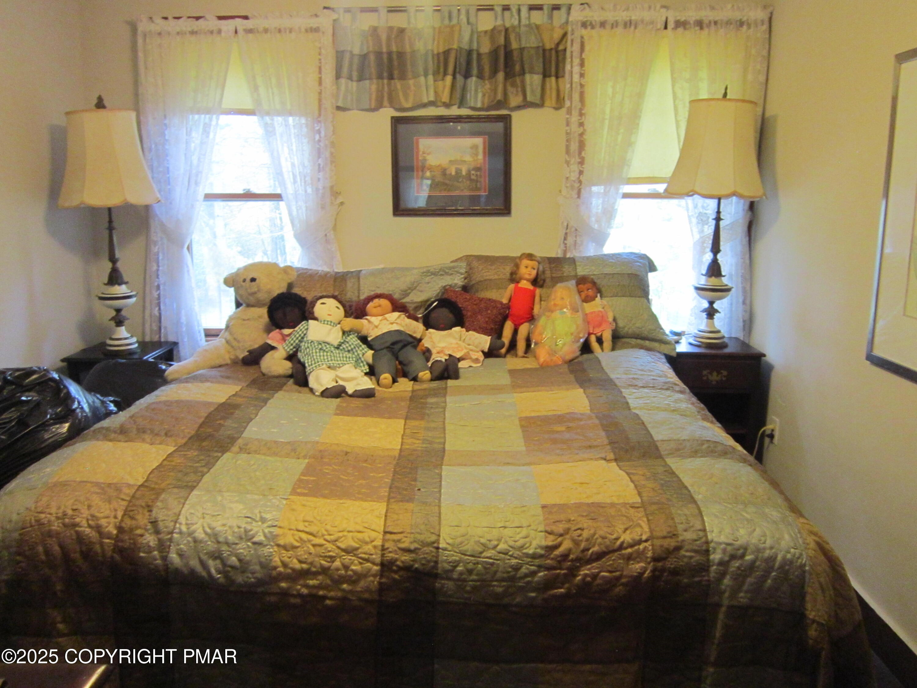 642 Tulip Tree Lane Cresco, PA 18326 - Photo 18 of 40 a bed sitting in a bedroom next to a window