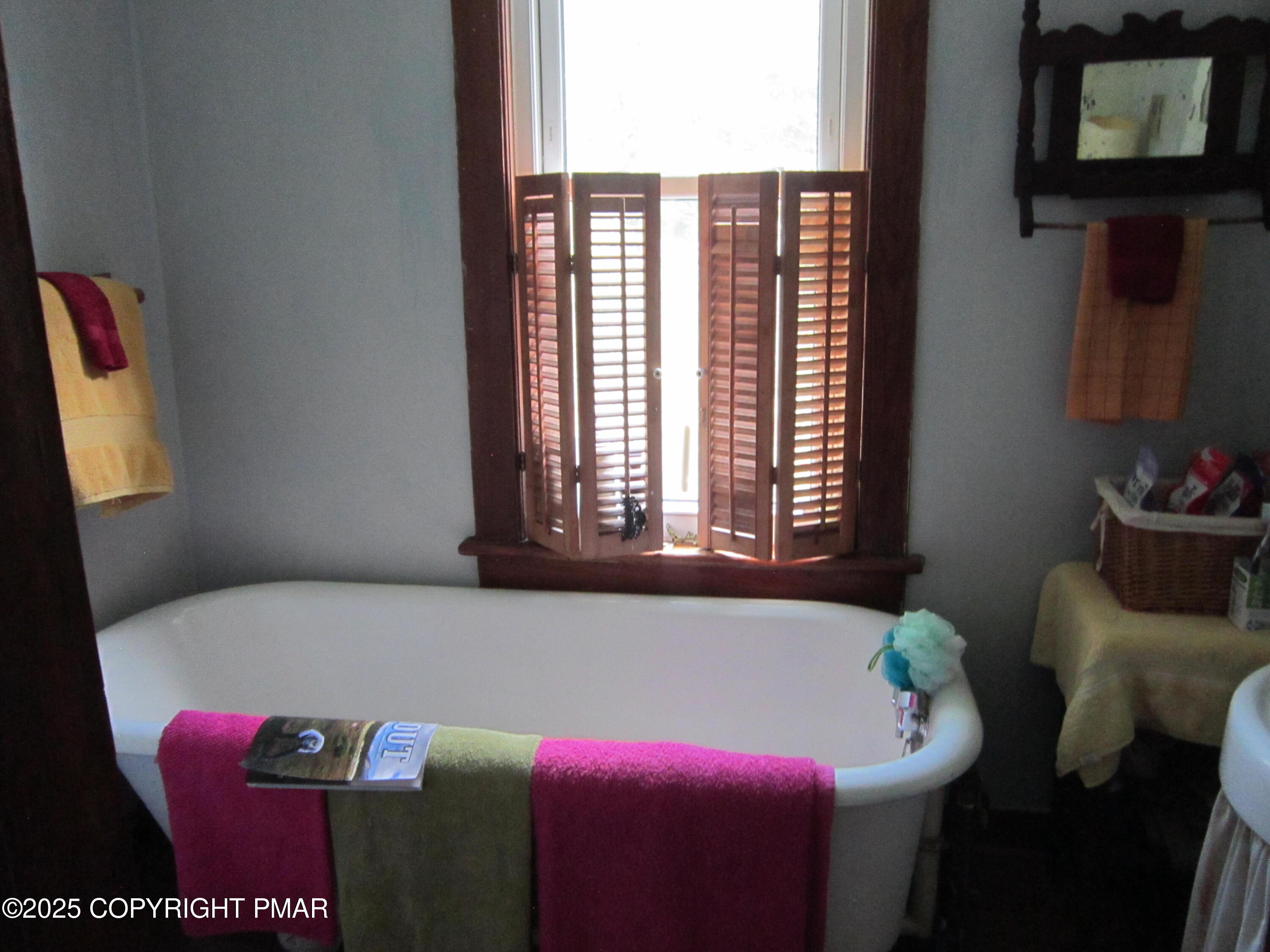 642 Tulip Tree Lane Cresco, PA 18326 - Photo 20 of 40 a bath room with a bed and a window