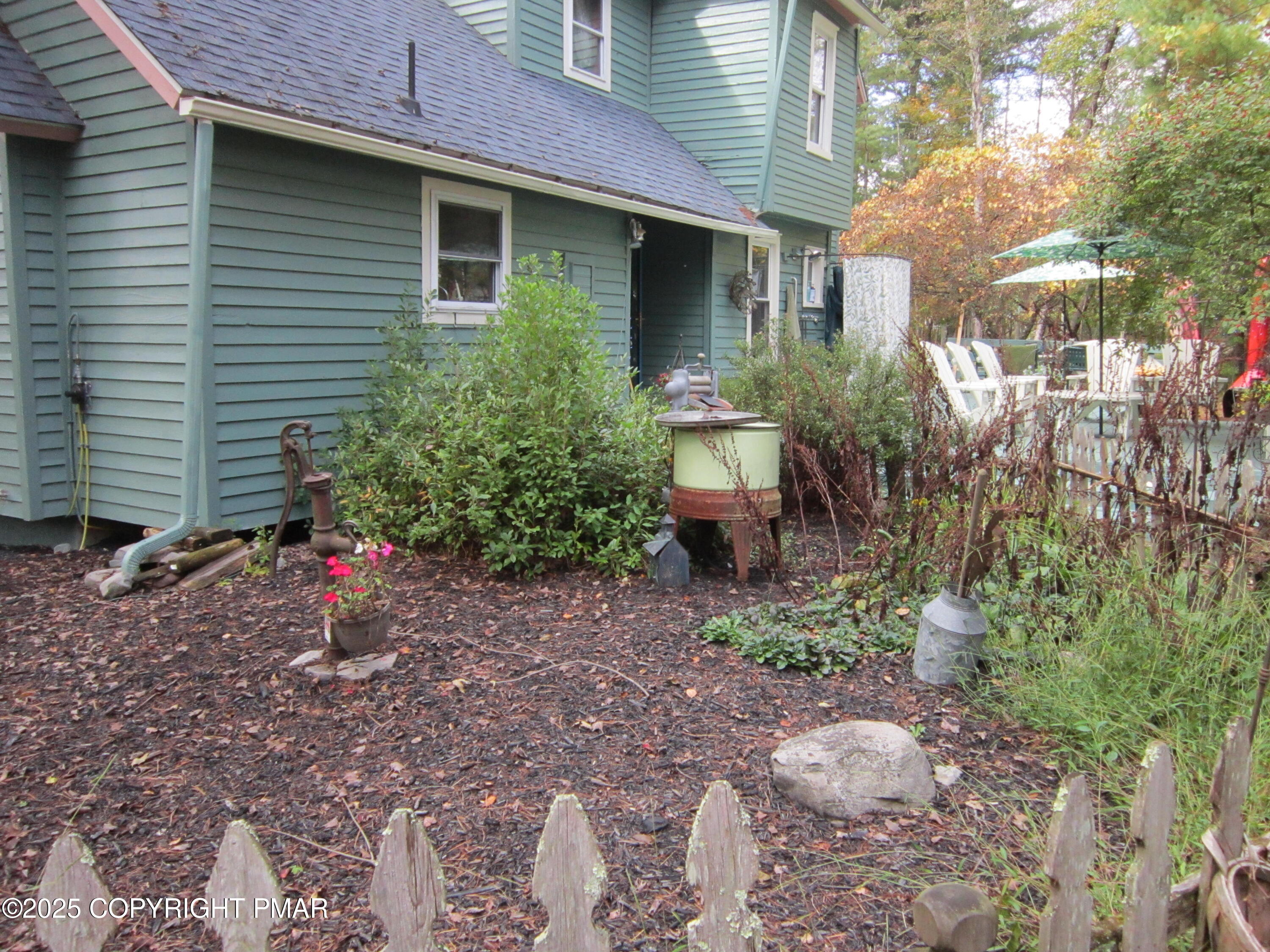 642 Tulip Tree Lane Cresco, PA 18326 - Photo 31 of 40 a view of a house with a yard and sitting area