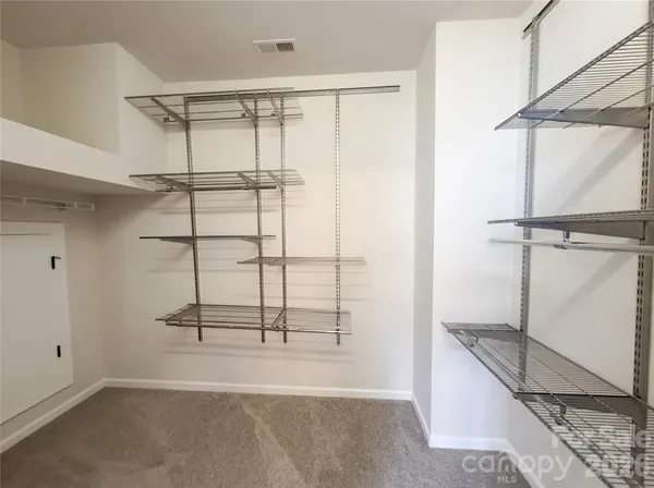 a view of a room with racks on the wall