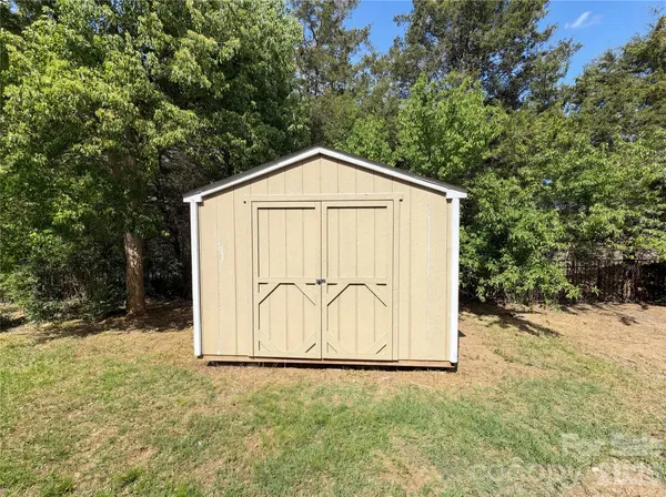 a house with trees in front of it
