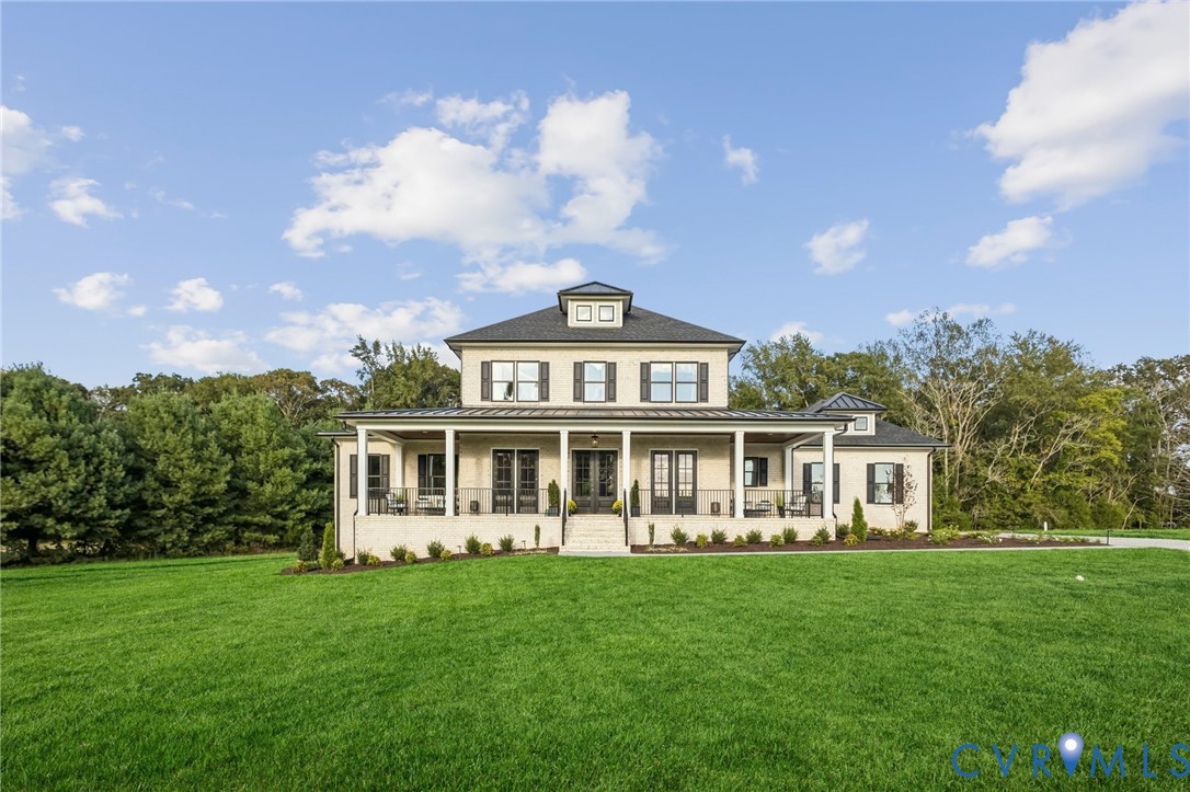 2 Rock Canyon Road Beaverdam, VA 23015 - Photo 4 of 31 a front view of a house with a yard table and chairs