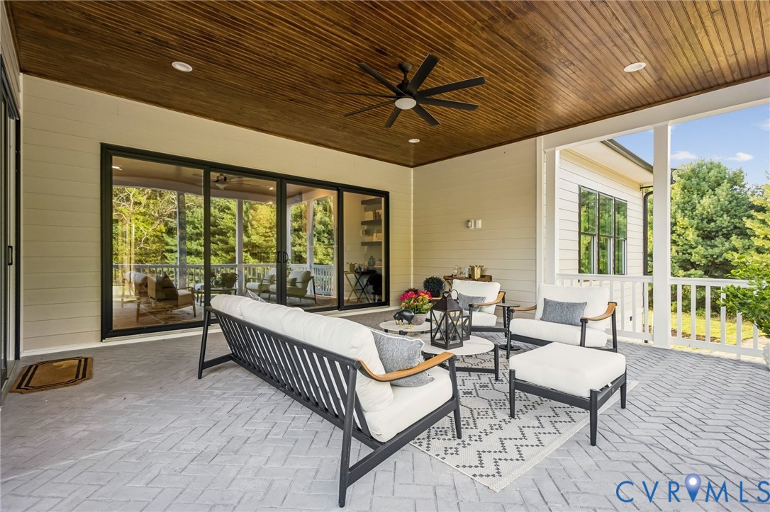 2 Rock Canyon Road Beaverdam, VA 23015 - Photo 7 of 31 a balcony with furniture and wooden floor