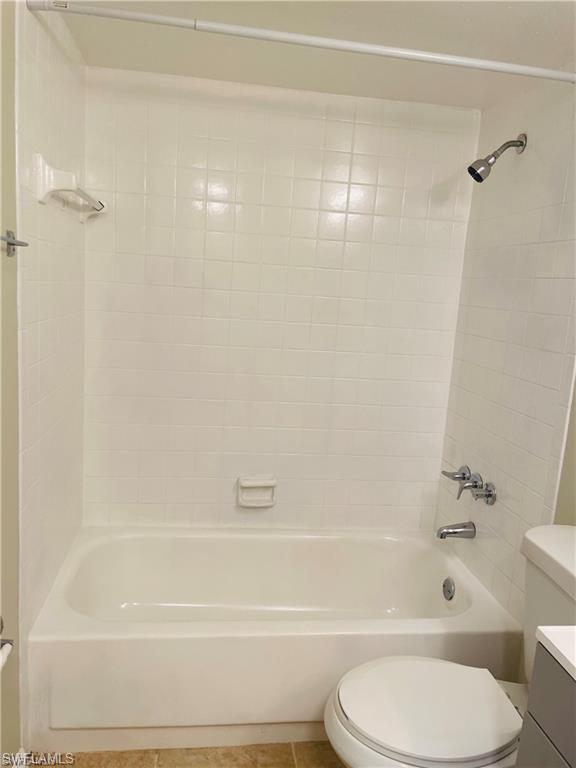 4290 Gulfstream Drive, Unit 9 Naples, FL 34112 - Photo 13 of 16 a bathroom with a shower and a toilet