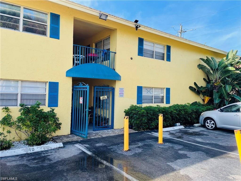 4290 Gulfstream Drive, Unit 9 Naples, FL 34112 - Photo 3 of 16 a front view of a house with garden