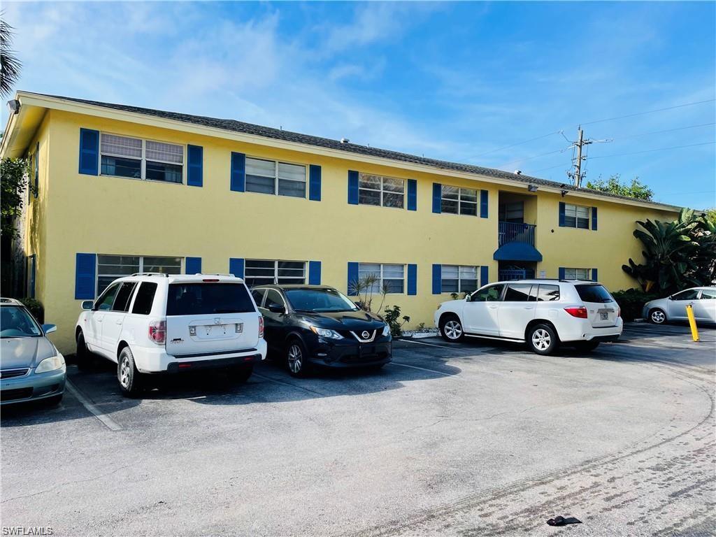 4290 Gulfstream Drive, Unit 9 Naples, FL 34112 - Photo 4 of 16 a car parked in front of a house