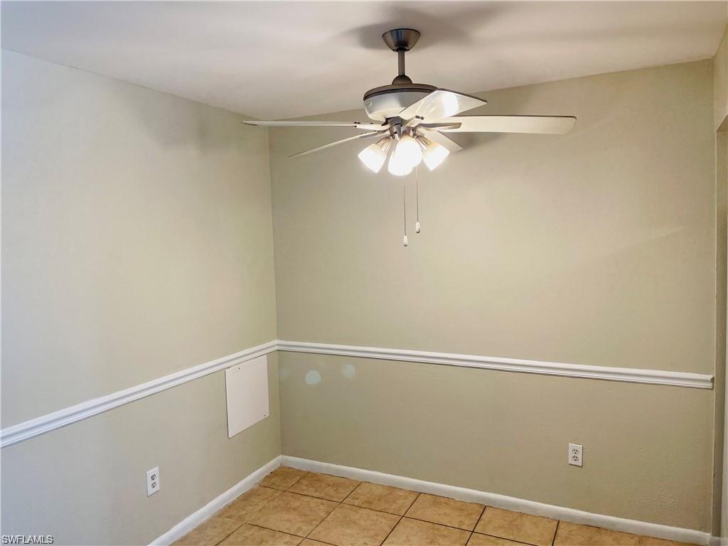 4290 Gulfstream Drive, Unit 9 Naples, FL 34112 - Photo 10 of 16 a view of a small space with a fan