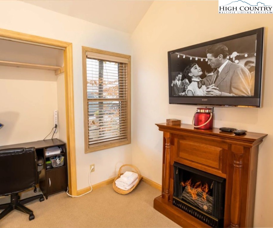 1534 Beech Mountain Parkway Beech Mountain, NC 28604 - Photo 16 of 29 a living room with furniture and a fireplace