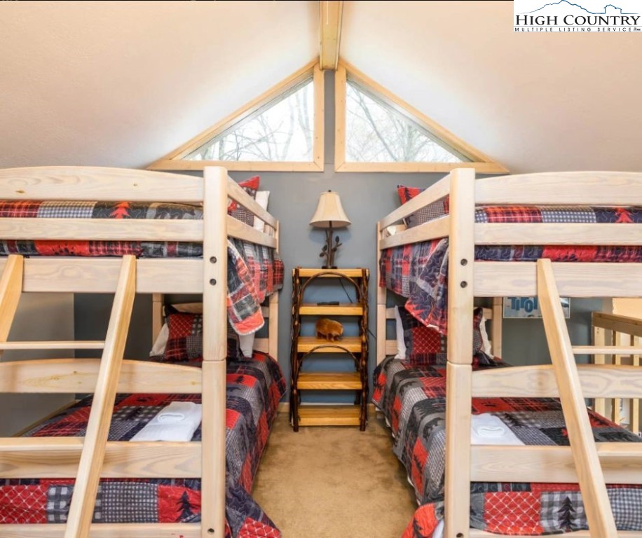 1534 Beech Mountain Parkway Beech Mountain, NC 28604 - Photo 19 of 29 a view of walk in closet with clothes and shoes