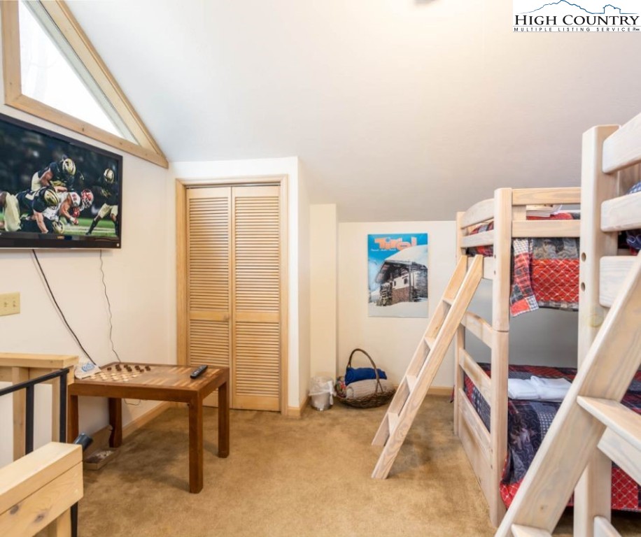 1534 Beech Mountain Parkway Beech Mountain, NC 28604 - Photo 20 of 29 a view of a workspace with furniture and a window