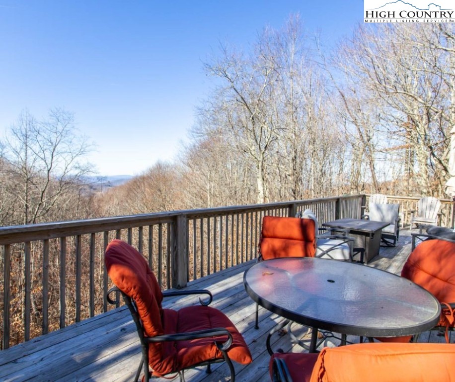 1534 Beech Mountain Parkway Beech Mountain, NC 28604 - Photo 2 of 29 a balcony with table and chairs