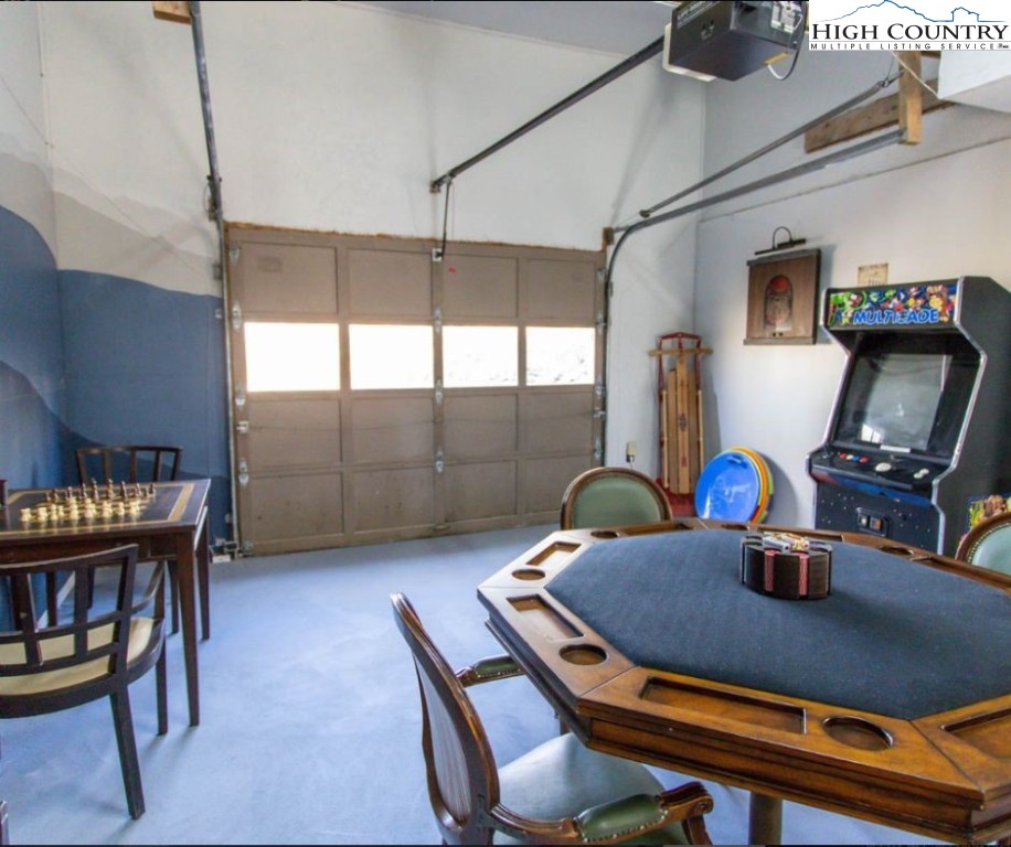 1534 Beech Mountain Parkway Beech Mountain, NC 28604 - Photo 22 of 29 a dining room with furniture and a window