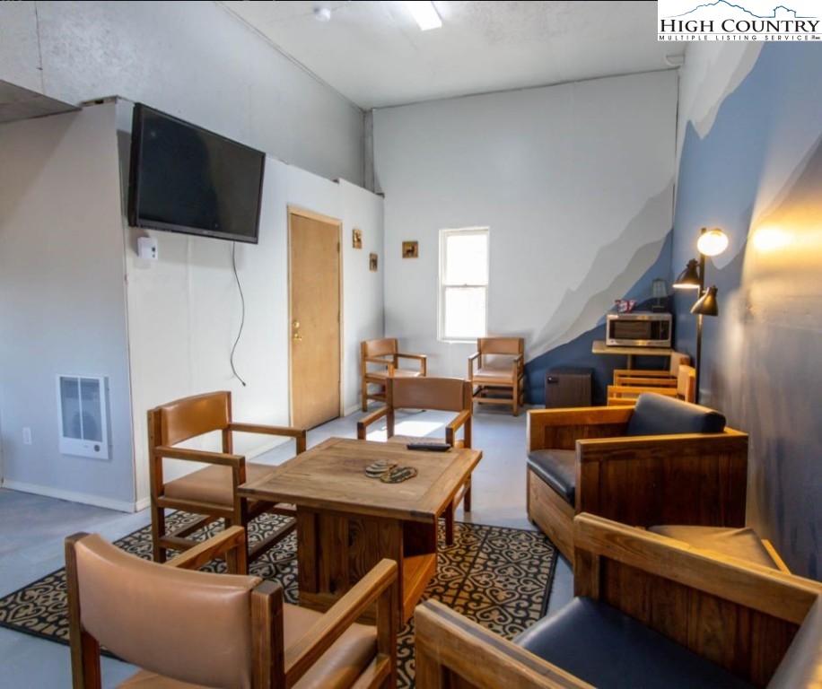 1534 Beech Mountain Parkway Beech Mountain, NC 28604 - Photo 25 of 29 a living room with furniture and a flat screen tv