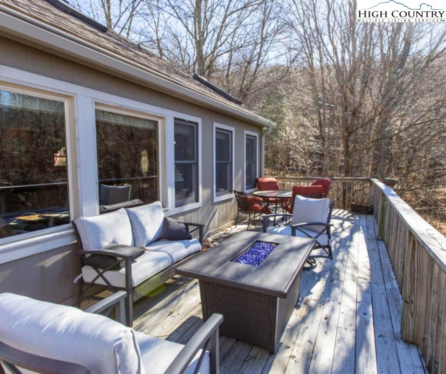 1534 Beech Mountain Parkway Beech Mountain, NC 28604 - Photo 28 of 29 a wooden bench sitting in front of a building