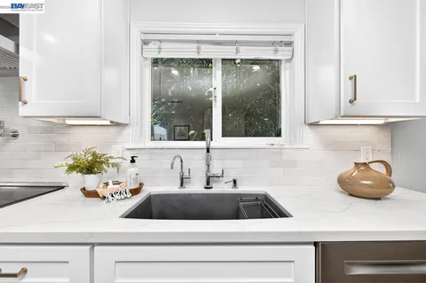 a kitchen with a sink and a window