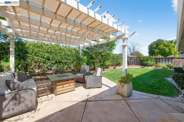 a view of a patio with couches and potted plants