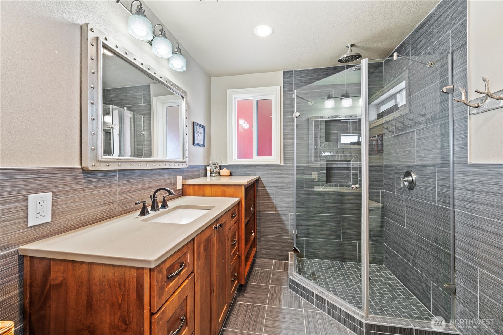 8708 Rd K Northeast Moses Lake, WA 98837 - Photo 12 of 40 a bathroom with a sink a toilet a mirror and shower